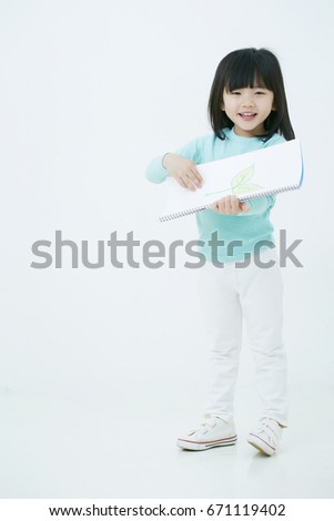 Girl with drawing paper 