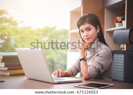 Businesswoman working with laptop and document at office 