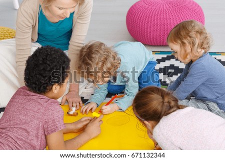 Group of kids in art class in kindergarten