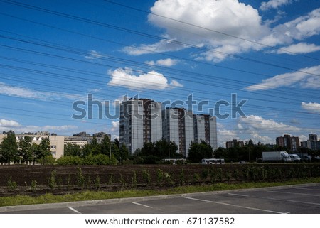 city skyline with house and wires