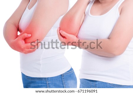 young women holding her elbow in pain. photo with red as a symbol for the hardening.