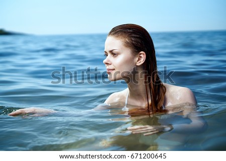 Woman is swimming                               