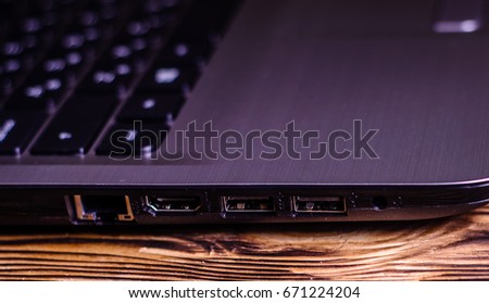 Modern laptop on the rustic wooden table