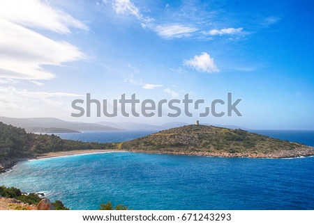 trachili beach with pirate watch tower on mountain in southwest Chios/Greece