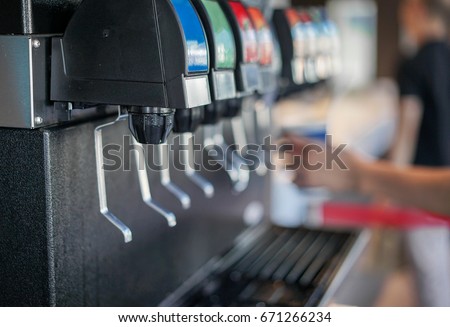 Water Soft drinks carbonated vending machine in restaurant shop soft focus Royalty-Free Stock Photo #671266234