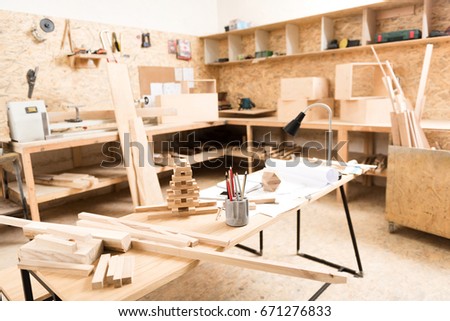 Desk with professional instruments are in joinery Royalty-Free Stock Photo #671276833