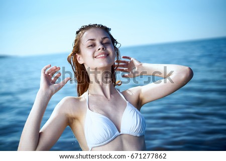 Woman in a swimsuit, the sea                               
