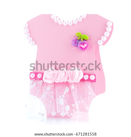 postcard with little pink baby dress decorated with roses and pearl beads isolated on white background