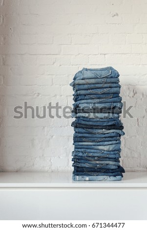 pile with blue jeans trousers