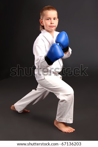 Taekwon-do boy in boxing gloves Royalty-Free Stock Photo #67136203