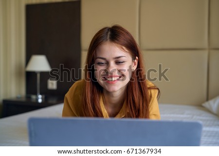 Young beautiful woman working at computer at home.