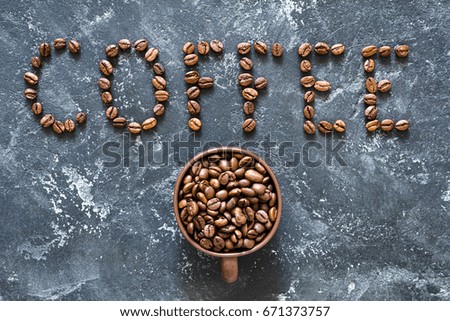 Coffee beans on stone background. Top view