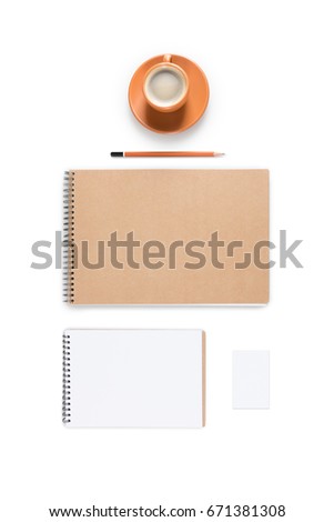 flat lay with ceramic coffee cup and empty notepads isolated on white