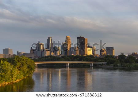 Beautiful late afternoon sun over the Minneapolis skyline. The image shows the Plymouth Bridge over the Mississippi River as seen from the Northeast.