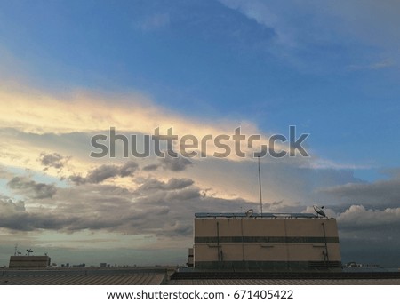 Dramatic cloudscape from rooftop of the building, after sunset sky background