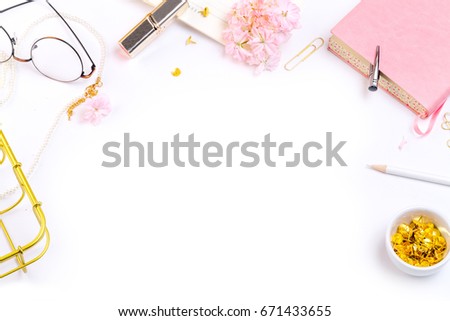 Workplace mockup with pink leather notebook, glasses and golden accessories top view. Flat lay with copy space.  Feminine working style concept.