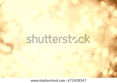Gold Bokeh Christmas blur confetti background concept for Banner decoration christmas happy new year 2022 card, Theme pastel tone gradient retro golden. Abstract golden chinese new year scene.