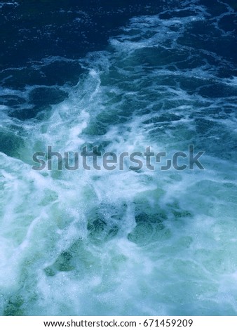 Wild blue foamy water