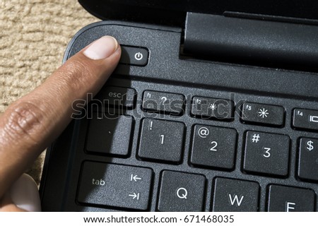 switch on notebook Royalty-Free Stock Photo #671468035