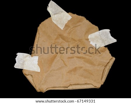 cardboard scrap and masking tape isolated on black background
