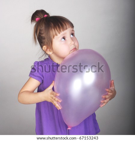 cute little baby with a lilac balloon