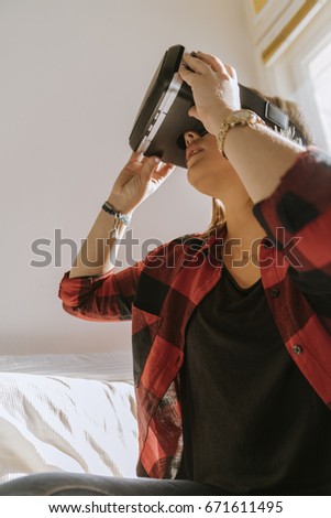 A Young Girl Using VR In The Bedroom