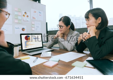 selective focus photo of business people using computer laptop meeting at conference desk and looking at document content thinking how to solving company financial problem. Royalty-Free Stock Photo #671634451