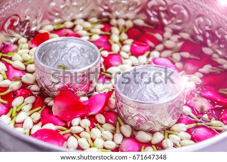 jasmine and rose leaf in bowl for bless adults, Thai traditional for Mother's day and Father's day in thailand.