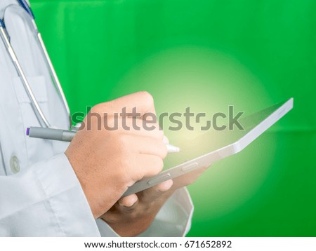 Asian Doctor record patient information.