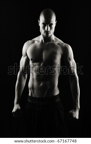 Artistic Fitness on a black background, Low key Royalty-Free Stock Photo #67167748