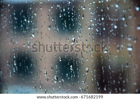 Water droplets outside the window Royalty-Free Stock Photo #671682199