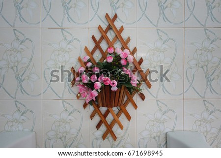flowers hanging on the wall. 