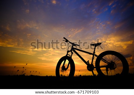 Bicycle on the sunset background Photographed with backlight technique. light Twilight.bike.