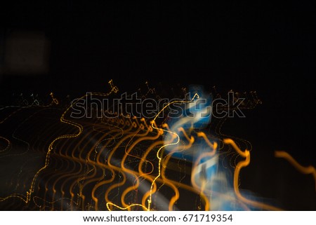 Orange and blue light painting lightpainting structure faded long exposure in dark night lights illuminated background in murcia in spain