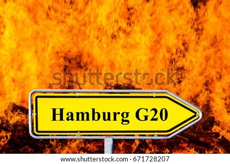 Signpost Hamburg G20 before flames