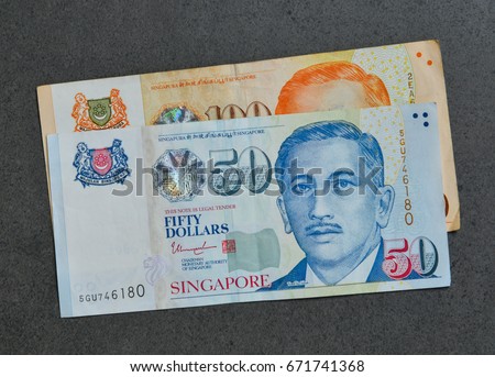 Singapore banknotes dollars (50-100 SGD). As of 2016, the Singapore dollar is the twelfth most traded currency in the world by value.
