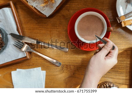 Red Cup of Hot Chocolate Isolated on Wooden Table