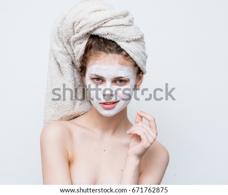Woman in cosmetic mask, spa