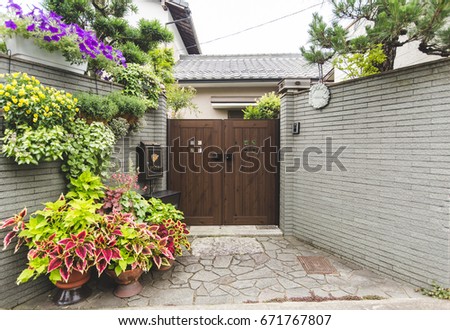 Japanese style, house front door decorates with various of colorful flowers and trees   Royalty-Free Stock Photo #671767807