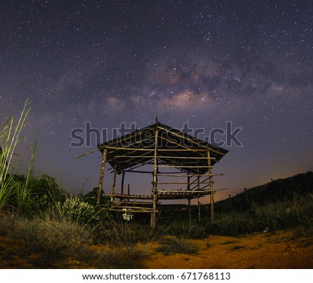 Milkyway over the outdated hut  in the early of night at Muadzam Shah, Pahang, Malaysia ( Visible noise due to high ISO, soft focus, shallow DOF, slight motion blur)