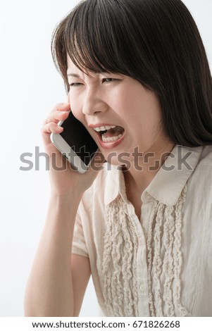 A young woman making a phone call, negative