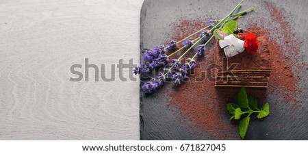 Chocolate cake with fresh berries. On a wooden background. Top review. Free space.