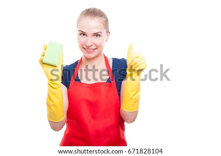 Positive cleaning lady holding sponge and rising thumb up on white background with text space