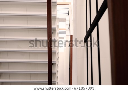 white stair of a modern building, view from above with vintage tone. stairs in office