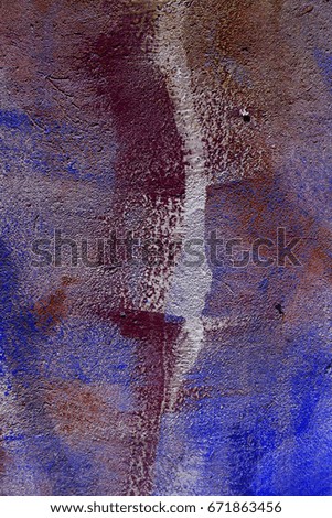 The old plastered brick wall wall with the remains of paint. Concrete, weathered, worn out wall is damaged by paint. Abstract background for creative design