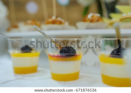 Top view of fruit jelly in glasses and sweet cookies