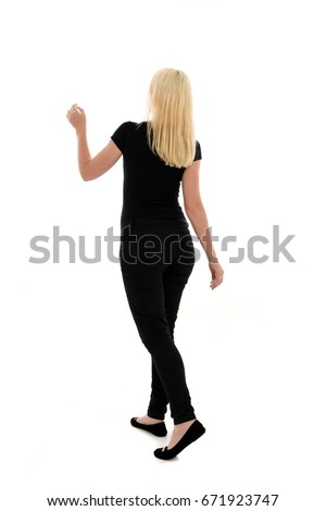 full length portrait of blonde woman wearing simple black clothing, standing pose. isolated on white background.
 Royalty-Free Stock Photo #671923747