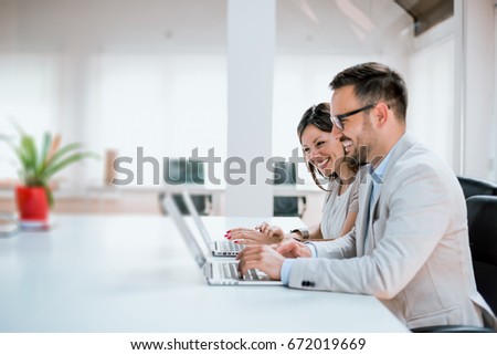 Image of two successful business partners working in the office