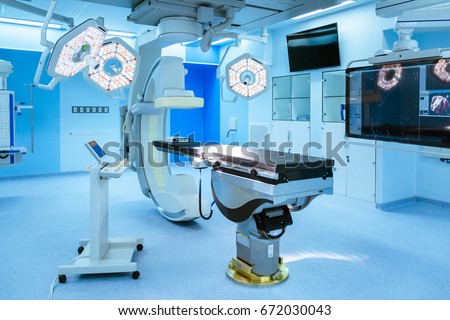 Equipment and medical devices in hybrid operating room  blue filter , Surgical procedures , the operating room of the Future  Royalty-Free Stock Photo #672030043