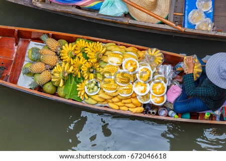 Long-tail boat with fruits on the floating market, Ha long bay, Vietnam